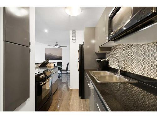 1102-706 15 Avenue Sw, Calgary, AB - Indoor Photo Showing Kitchen With Double Sink