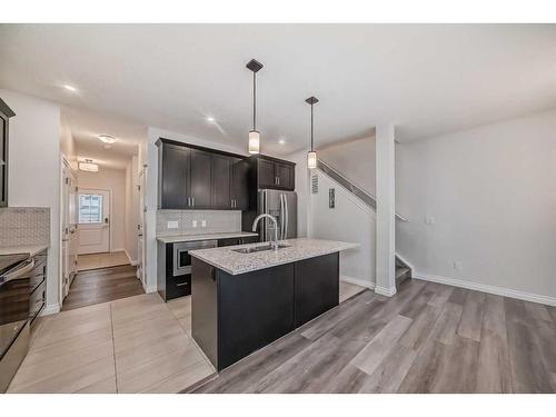 1453 Bayview Point Sw, Airdrie, AB - Indoor Photo Showing Kitchen With Upgraded Kitchen