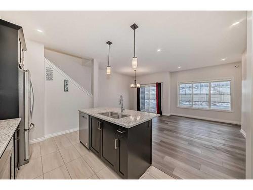 1453 Bayview Point Sw, Airdrie, AB - Indoor Photo Showing Kitchen With Double Sink With Upgraded Kitchen