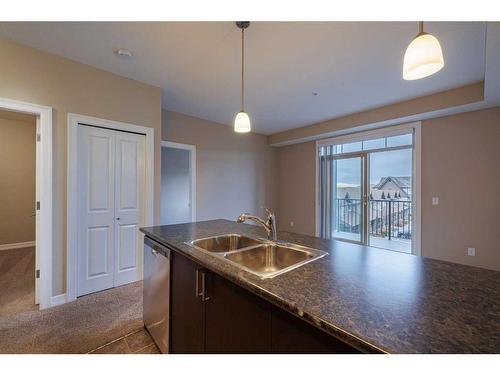 320-117 Copperpond Common Se, Calgary, AB - Indoor Photo Showing Kitchen With Double Sink