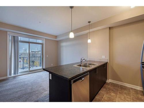 320-117 Copperpond Common Se, Calgary, AB - Indoor Photo Showing Kitchen With Double Sink