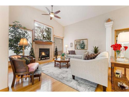 119 Rocky Ridge Villas Nw, Calgary, AB - Indoor Photo Showing Living Room With Fireplace