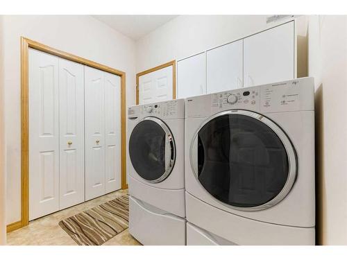 119 Rocky Ridge Villas Nw, Calgary, AB - Indoor Photo Showing Laundry Room