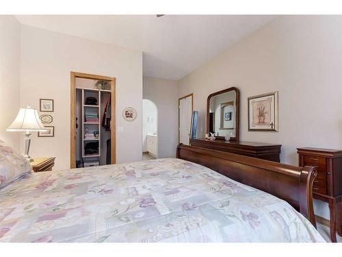 119 Rocky Ridge Villas Nw, Calgary, AB - Indoor Photo Showing Bedroom