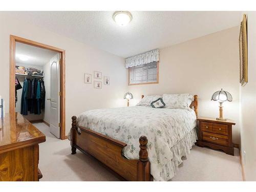 119 Rocky Ridge Villas Nw, Calgary, AB - Indoor Photo Showing Bedroom