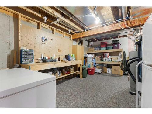 119 Rocky Ridge Villas Nw, Calgary, AB - Indoor Photo Showing Basement