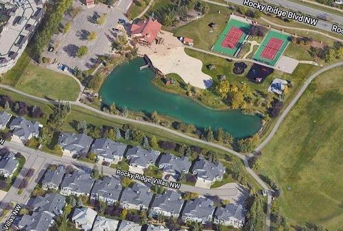 119 Rocky Ridge Villas Nw, Calgary, AB -  With Body Of Water