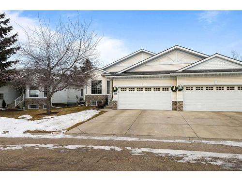 119 Rocky Ridge Villas Nw, Calgary, AB - Outdoor With Facade