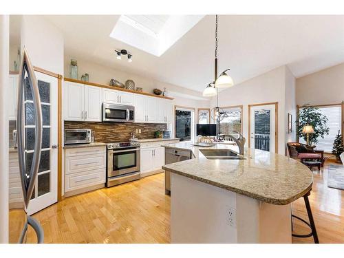 119 Rocky Ridge Villas Nw, Calgary, AB - Indoor Photo Showing Kitchen With Double Sink