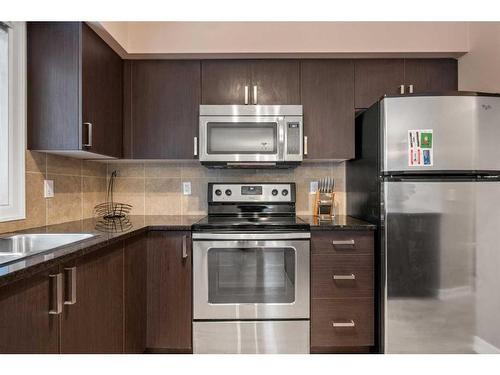 513-121 Copperpond Common Se, Calgary, AB - Indoor Photo Showing Kitchen With Upgraded Kitchen