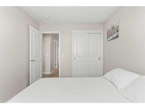 230 Hillcrest Square Sw, Airdrie, AB - Indoor Photo Showing Bedroom