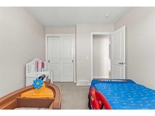 230 Hillcrest Square Sw, Airdrie, AB - Indoor Photo Showing Bedroom