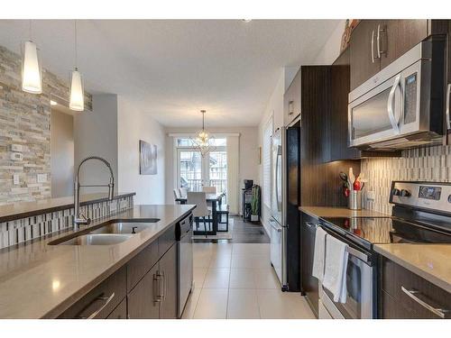 320 Ascot Circle Sw, Calgary, AB - Indoor Photo Showing Kitchen With Stainless Steel Kitchen With Double Sink With Upgraded Kitchen