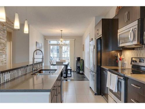 320 Ascot Circle Sw, Calgary, AB - Indoor Photo Showing Kitchen With Stainless Steel Kitchen With Double Sink With Upgraded Kitchen