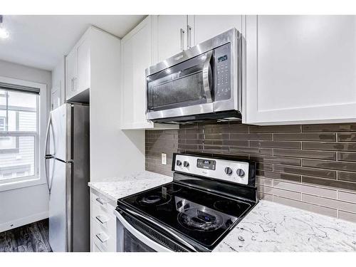 49 Evanscrest Court Nw, Calgary, AB - Indoor Photo Showing Kitchen With Stainless Steel Kitchen