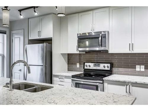 49 Evanscrest Court Nw, Calgary, AB - Indoor Photo Showing Kitchen With Stainless Steel Kitchen With Double Sink With Upgraded Kitchen