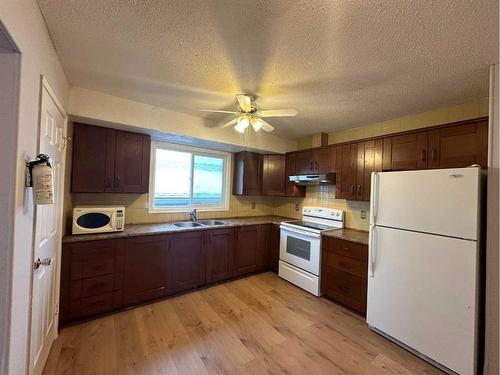 3833 Dover Ridge Drive Se, Calgary, AB - Indoor Photo Showing Kitchen With Double Sink