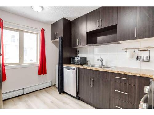 611-1335 12 Avenue Sw, Calgary, AB - Indoor Photo Showing Kitchen With Double Sink