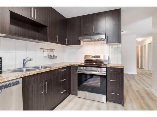 611-1335 12 Avenue Sw, Calgary, AB - Indoor Photo Showing Kitchen With Double Sink