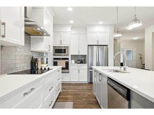 101 Mist Mountain Rise, Okotoks, AB - Indoor Photo Showing Kitchen With Double Sink With Upgraded Kitchen