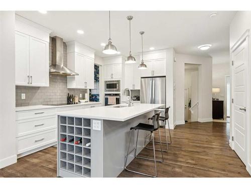 101 Mist Mountain Rise, Okotoks, AB - Indoor Photo Showing Kitchen With Upgraded Kitchen