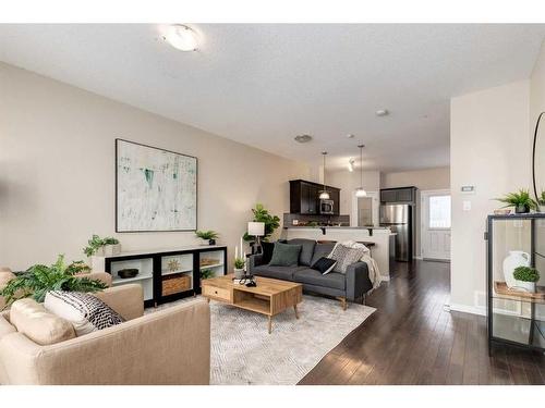 3904-1001 8 Street Nw, Airdrie, AB - Indoor Photo Showing Living Room With Fireplace