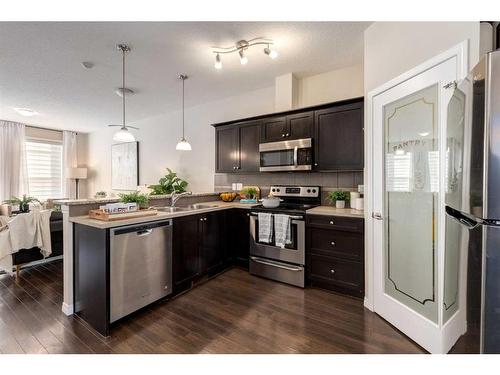 3904-1001 8 Street Nw, Airdrie, AB - Indoor Photo Showing Kitchen With Stainless Steel Kitchen With Upgraded Kitchen