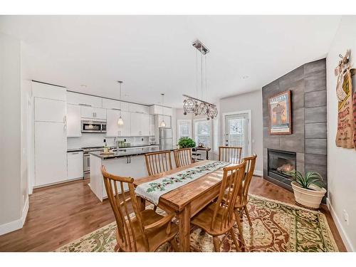 2413 Sorrel Mews Sw, Calgary, AB - Indoor Photo Showing Dining Room With Fireplace