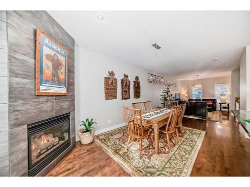 2413 Sorrel Mews Sw, Calgary, AB - Indoor Photo Showing Dining Room With Fireplace