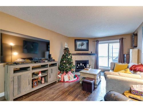 4116-13045 6 Street Sw, Calgary, AB - Indoor Photo Showing Living Room With Fireplace