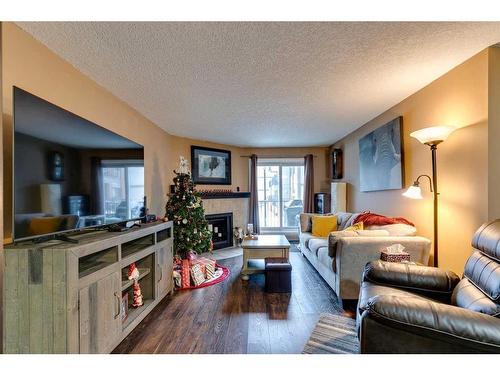 4116-13045 6 Street Sw, Calgary, AB - Indoor Photo Showing Living Room With Fireplace