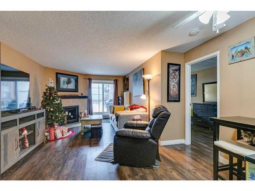 4116-13045 6 Street Sw, Calgary, AB - Indoor Photo Showing Living Room With Fireplace