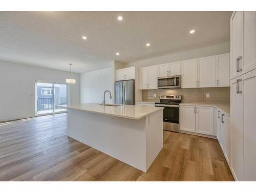 325 Baneberry Way Sw, Airdrie, AB - Indoor Photo Showing Kitchen With Stainless Steel Kitchen With Upgraded Kitchen