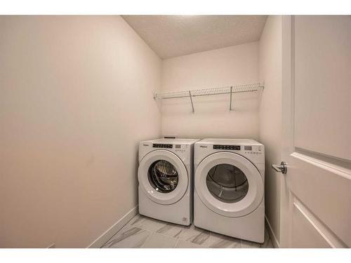 325 Baneberry Way Sw, Airdrie, AB - Indoor Photo Showing Laundry Room