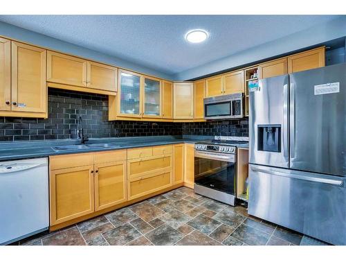 65 Saddleback Road Ne, Calgary, AB - Indoor Photo Showing Kitchen With Double Sink