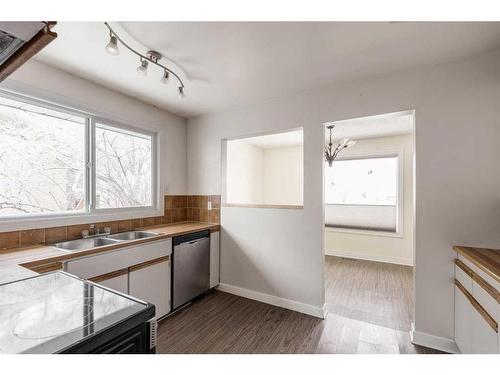 6119 Penedo Way Se, Calgary, AB - Indoor Photo Showing Kitchen With Double Sink