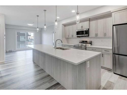 3203-33 Carringham Gate Nw, Calgary, AB - Indoor Photo Showing Kitchen With Stainless Steel Kitchen With Double Sink With Upgraded Kitchen