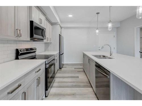 3203-33 Carringham Gate Nw, Calgary, AB - Indoor Photo Showing Kitchen With Stainless Steel Kitchen With Double Sink With Upgraded Kitchen