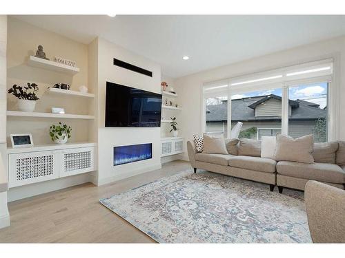 2040 48 Avenue Sw, Calgary, AB - Indoor Photo Showing Living Room With Fireplace