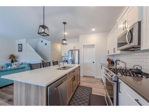 596 Chinook Gate Square, Airdrie, AB - Indoor Photo Showing Kitchen With Stainless Steel Kitchen With Double Sink With Upgraded Kitchen