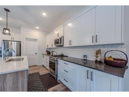 596 Chinook Gate Square, Airdrie, AB - Indoor Photo Showing Kitchen With Stainless Steel Kitchen With Upgraded Kitchen