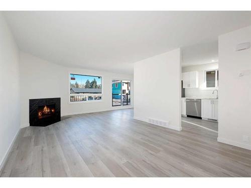 5137 17 Avenue Nw, Calgary, AB - Indoor Photo Showing Living Room With Fireplace