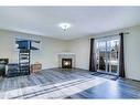 315 Appleglen Place Se, Calgary, AB  - Indoor Photo Showing Living Room With Fireplace 