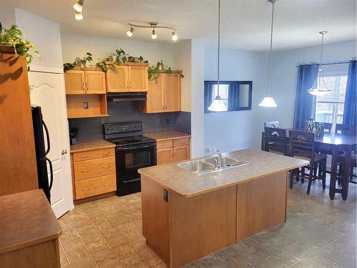 2398 Sagewood Crescent Sw, Airdrie, AB - Indoor Photo Showing Kitchen With Double Sink