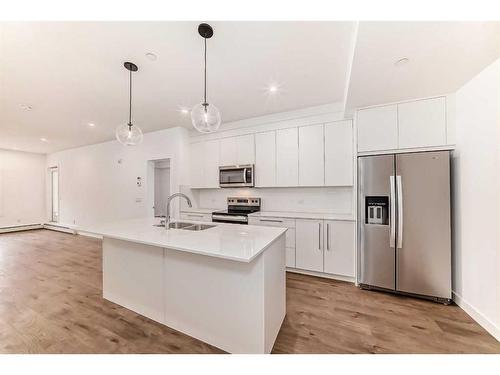 2402-60 Skyview Ranch Road Ne, Calgary, AB - Indoor Photo Showing Kitchen With Stainless Steel Kitchen With Double Sink With Upgraded Kitchen