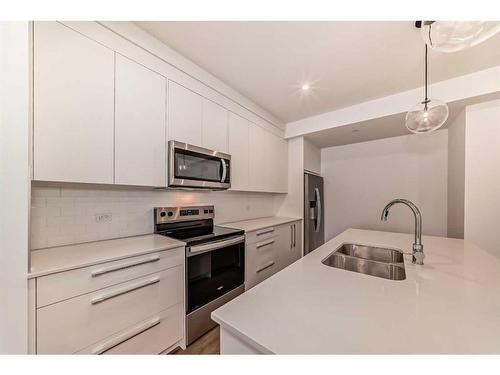 2402-60 Skyview Ranch Road Ne, Calgary, AB - Indoor Photo Showing Kitchen With Stainless Steel Kitchen With Double Sink With Upgraded Kitchen