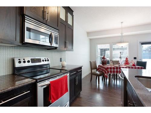 100 Cranridge Crescent Se, Calgary, AB - Indoor Photo Showing Kitchen With Double Sink