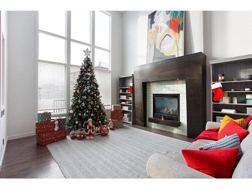 100 Cranridge Crescent Se, Calgary, AB - Indoor Photo Showing Living Room With Fireplace