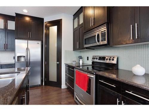 100 Cranridge Crescent Se, Calgary, AB - Indoor Photo Showing Kitchen With Double Sink With Upgraded Kitchen