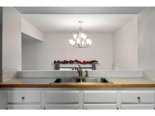 1401-919 38 Street Ne, Calgary, AB - Indoor Photo Showing Kitchen With Double Sink